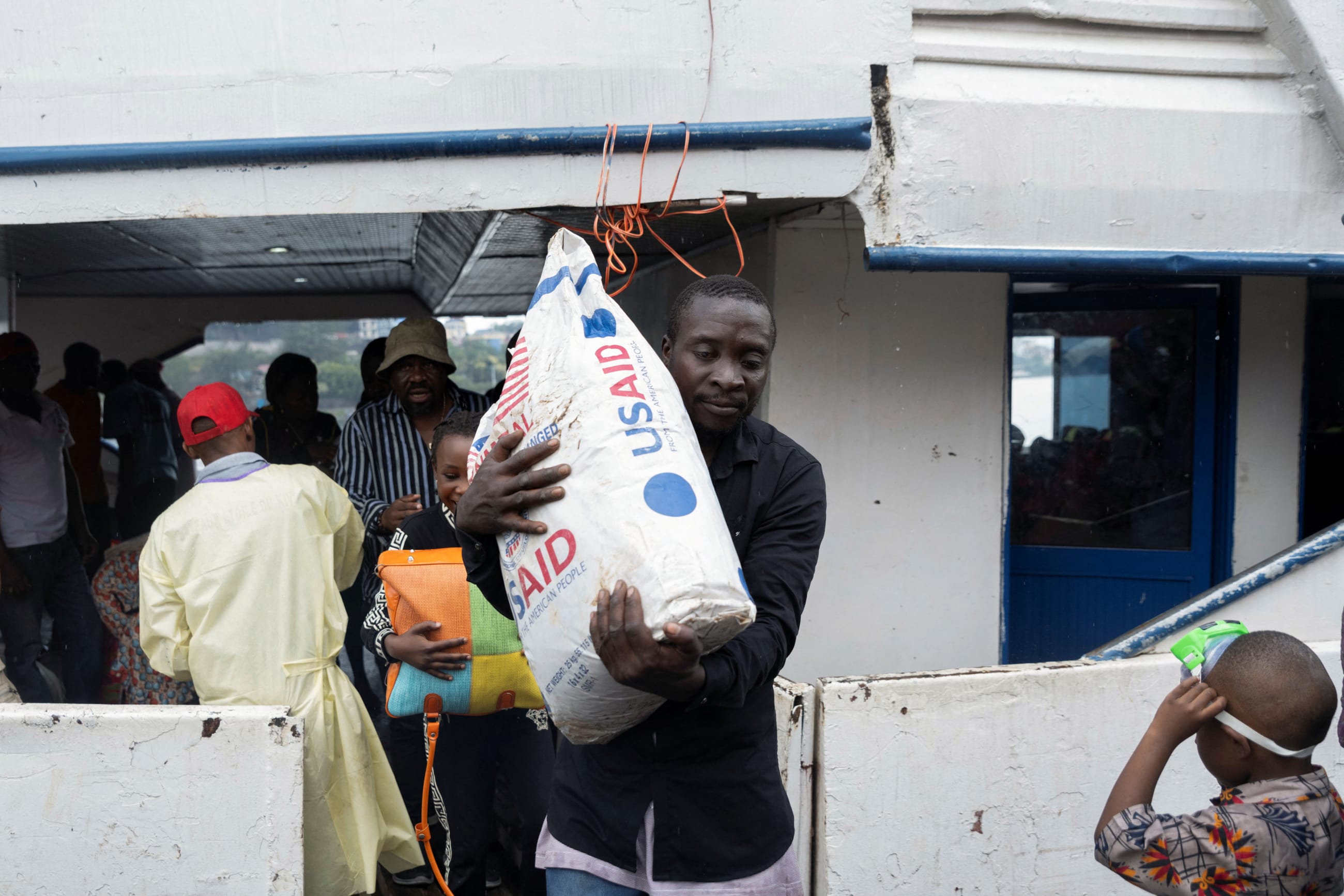 Passengers from Bukavu disembark from the Englebert boat, on its first trip between Bukavu and Goma since the city was taken by M23 rebels, in Goma, Democratic Republic of Congo, on February 18, 2025.