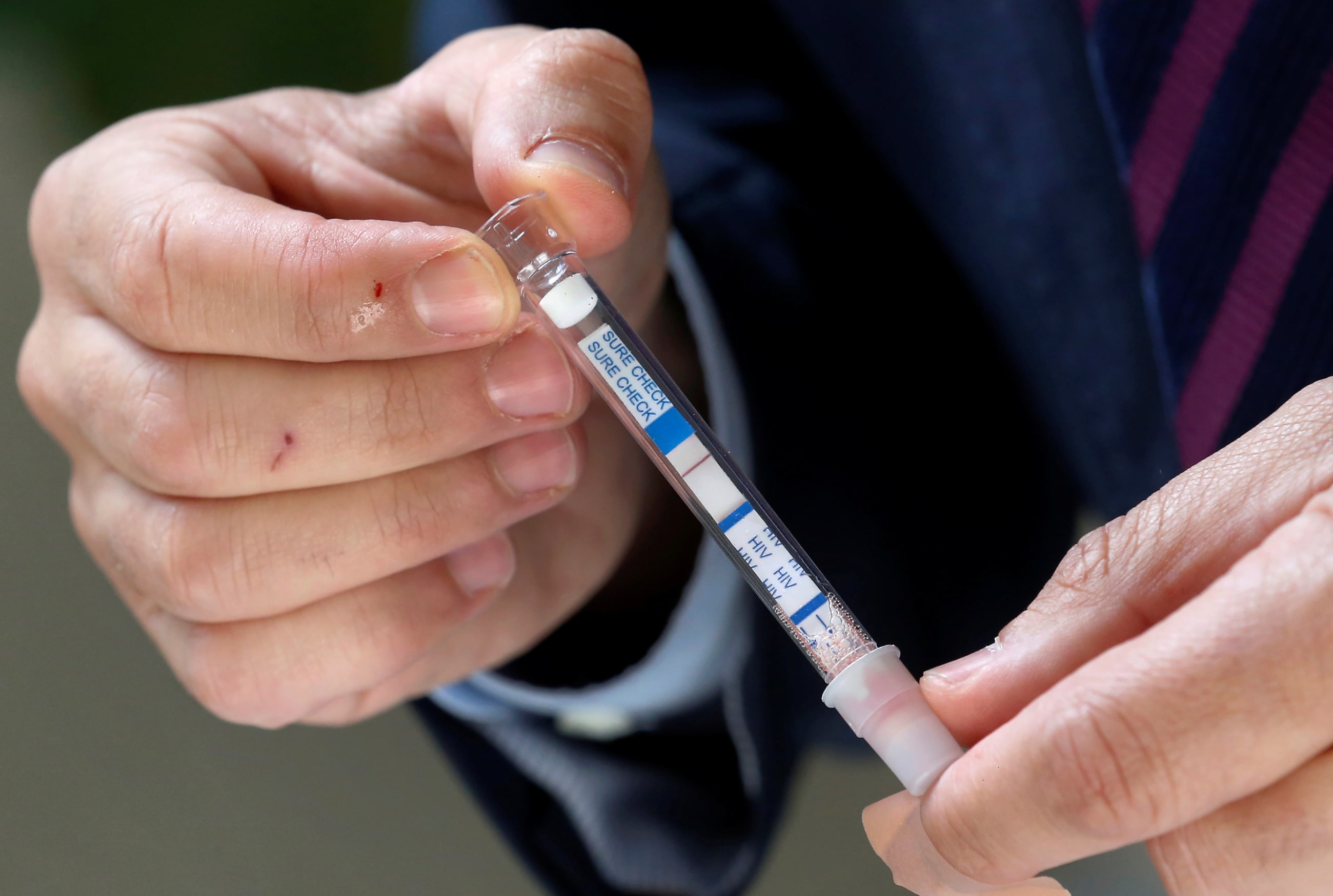 Chilean Senator Francisco Chahuan presents an HIV self-test kit in an effort to encourage people to check their health, in Valparaiso, Chile, on December 11, 2018.