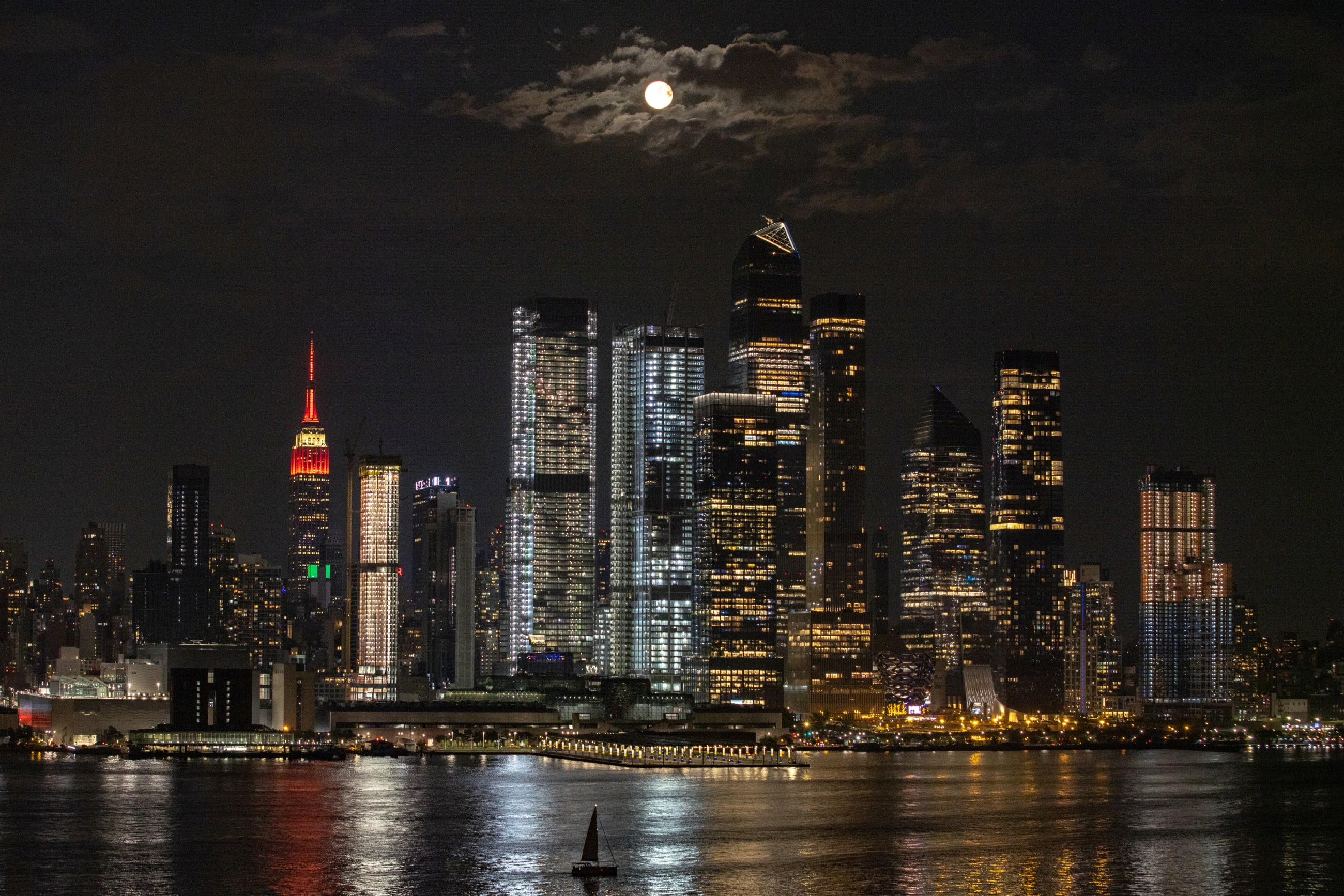 The full moon known as the Buck Moon rises over the New York City skyline, as seen from Weehawken, New Jersey, on July 23, 2021.