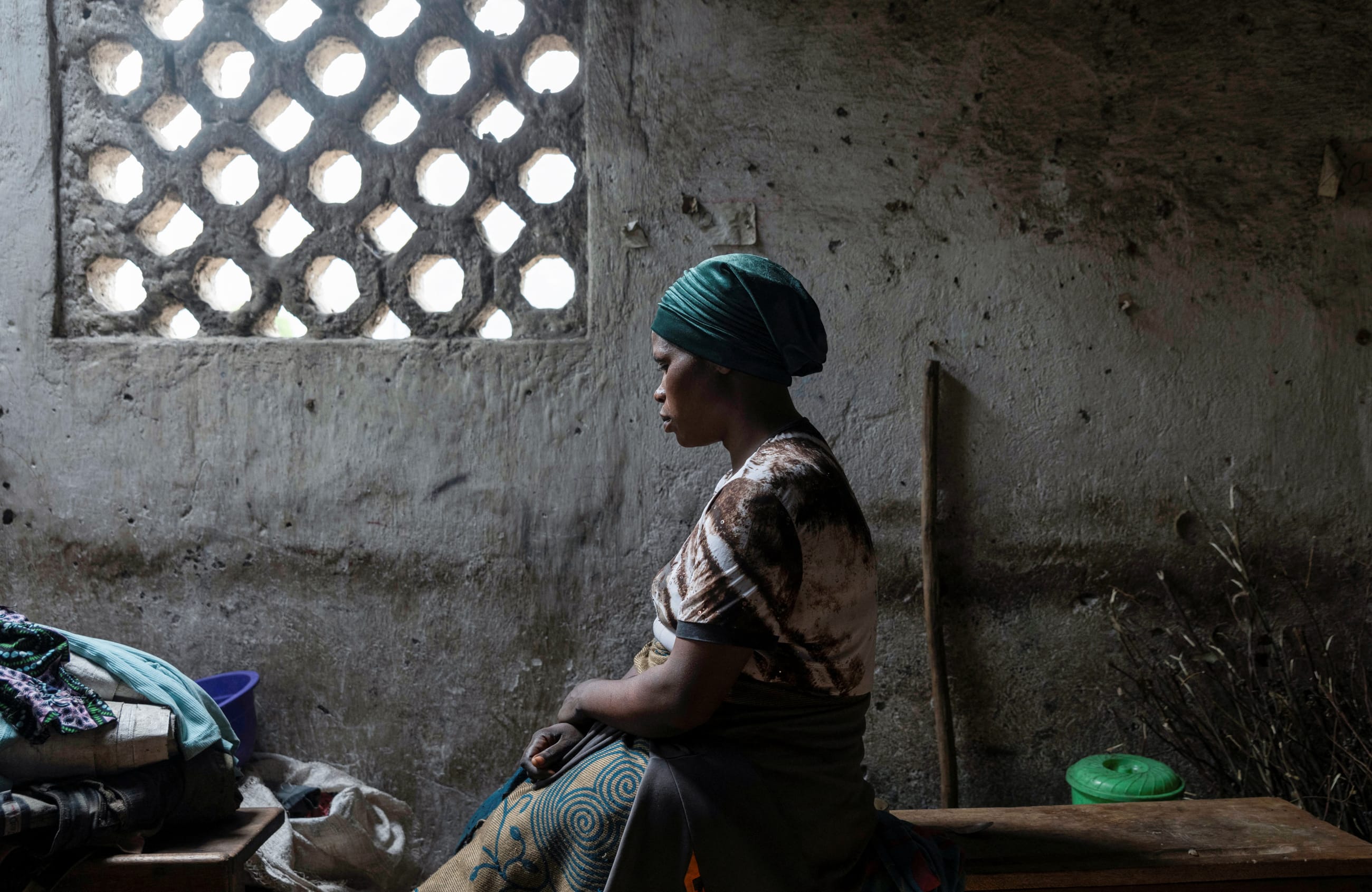 Florence Mushimye poses for a portrait in a classroom where they are taking refuge after being asked to leave Kalenga village by the M23 rebels, in Sake, eastern Democratic Republic of Congo, on March 13, 2025.