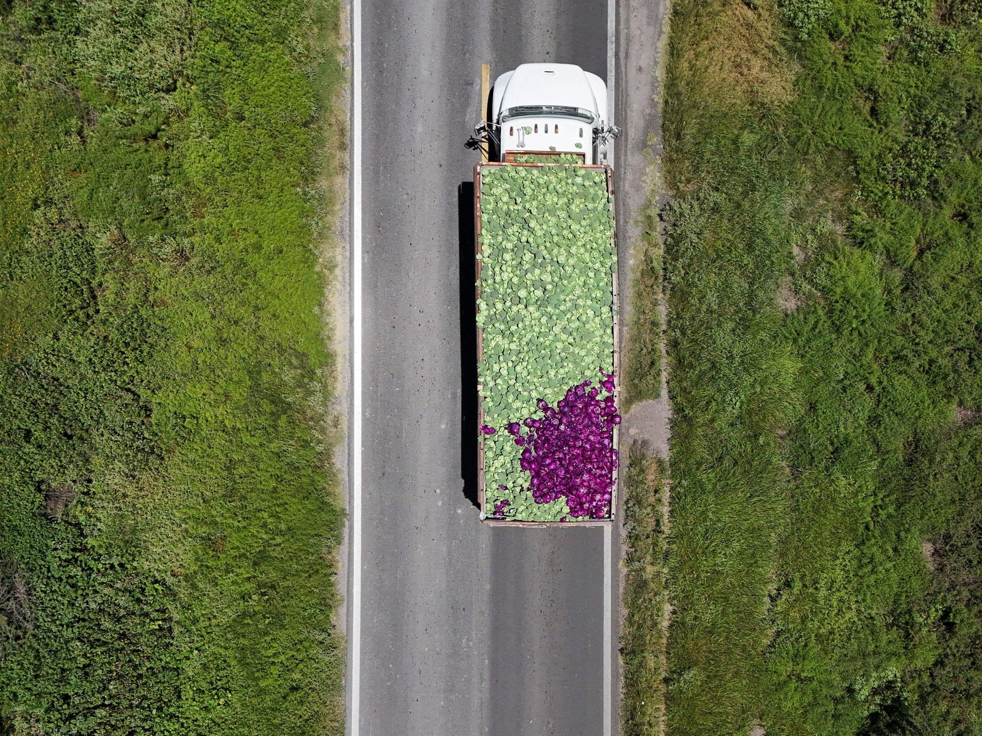 A drone view shows a truck transporting fresh produce after leaving the installations of U.S. supplier Taylor Farms, following the temporary closure announced by Taylor Farms, in Doctor Mora, Guanajuato state, Mexico, on July 24, 2026.  