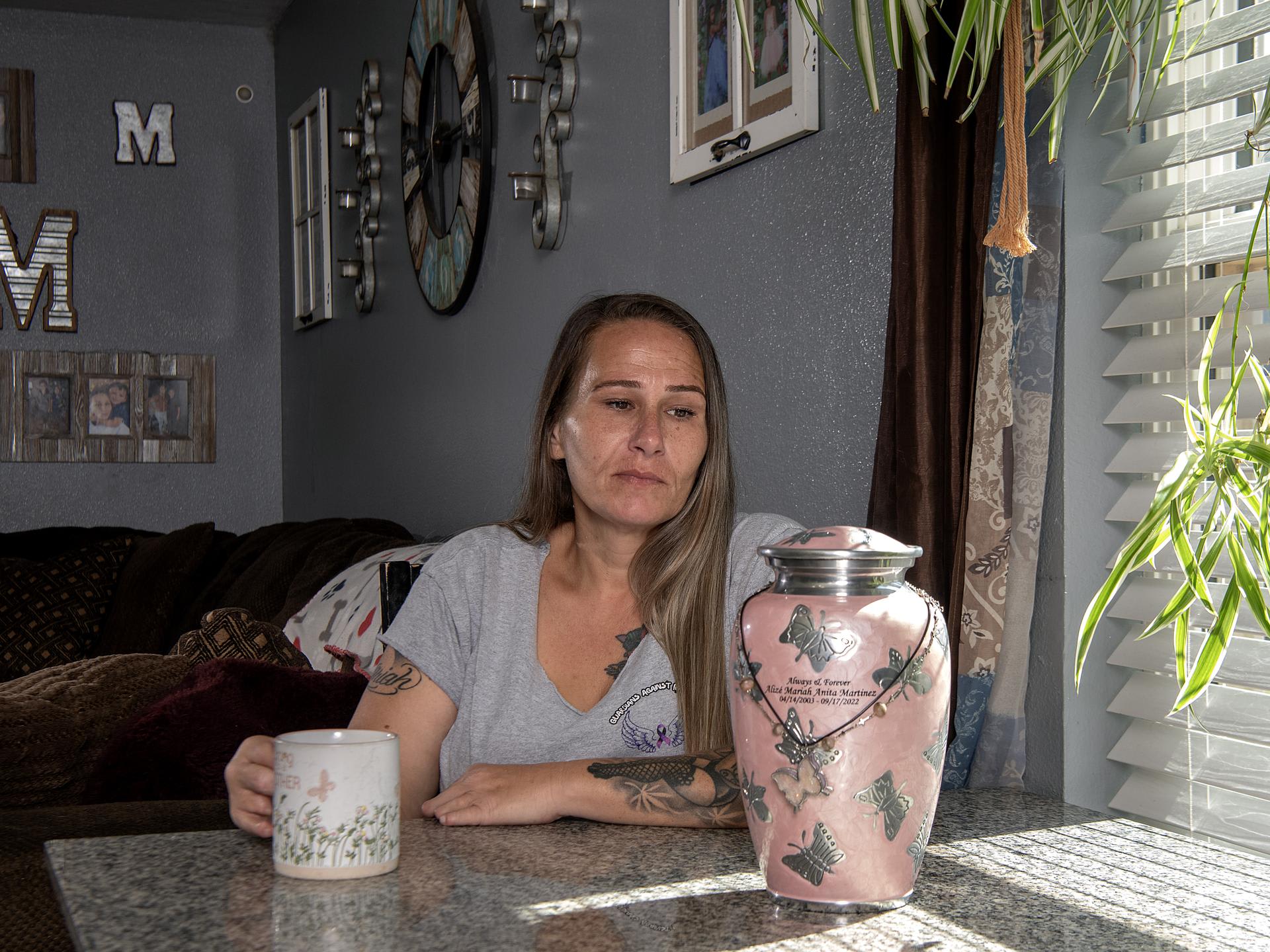 Silvia Martinez sits in her kitchen with her daughter Alize' urn on August 10, 2026 in Wichita Falls, Texas. Alizé passed in 2022 to an overdose. She was 19 years old.