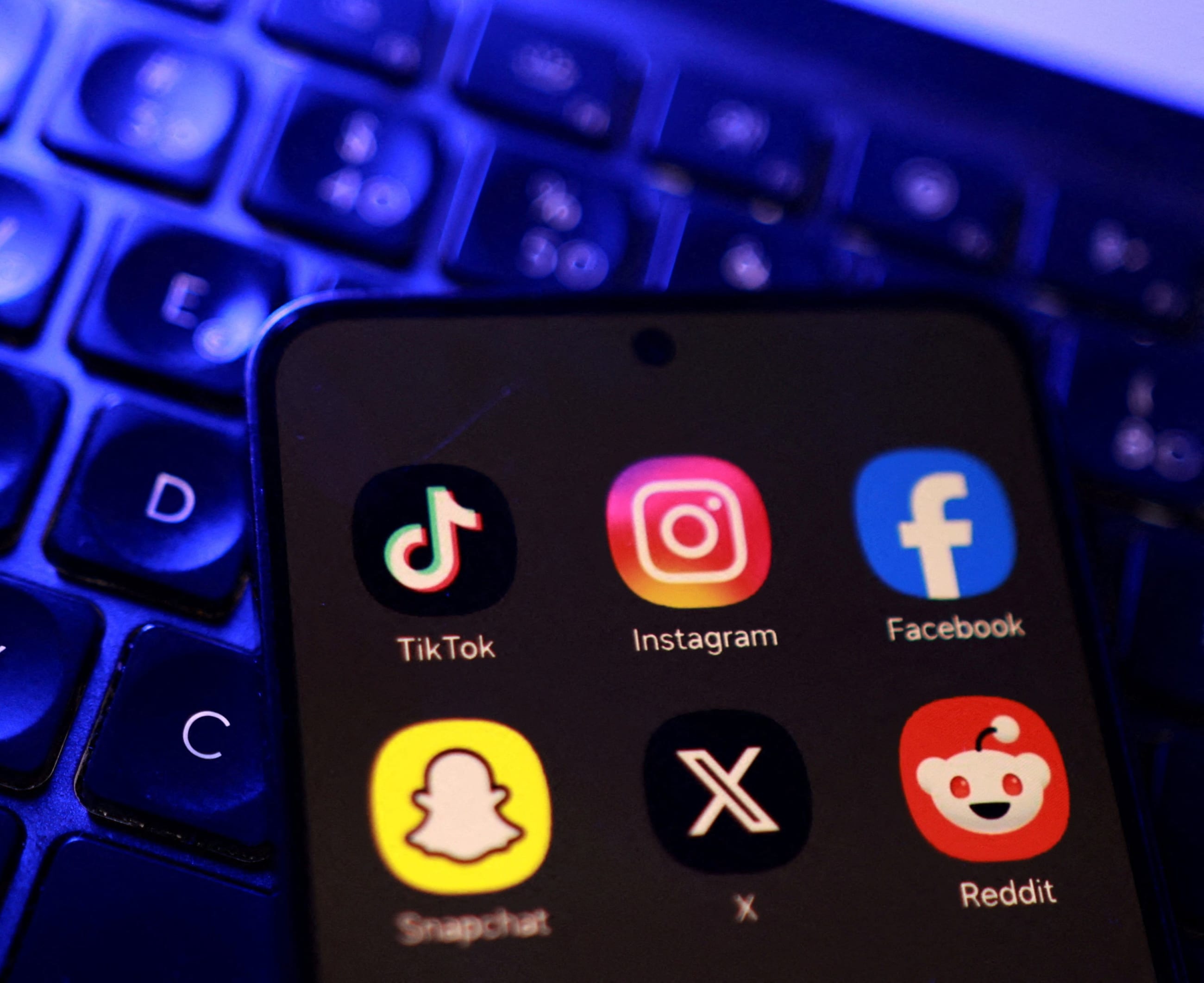 TikTok, Instagram, Facebook, Snapchat, X, and Reddit app icons are seen in this illustration, taken on June 15, 2026.