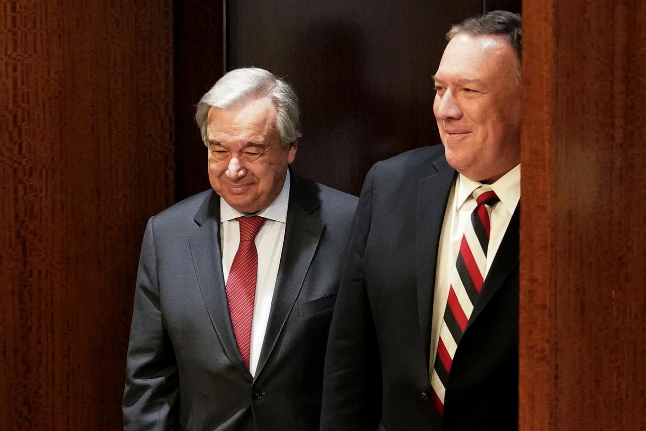 The photo shows the two diplomats walking together and smiling.