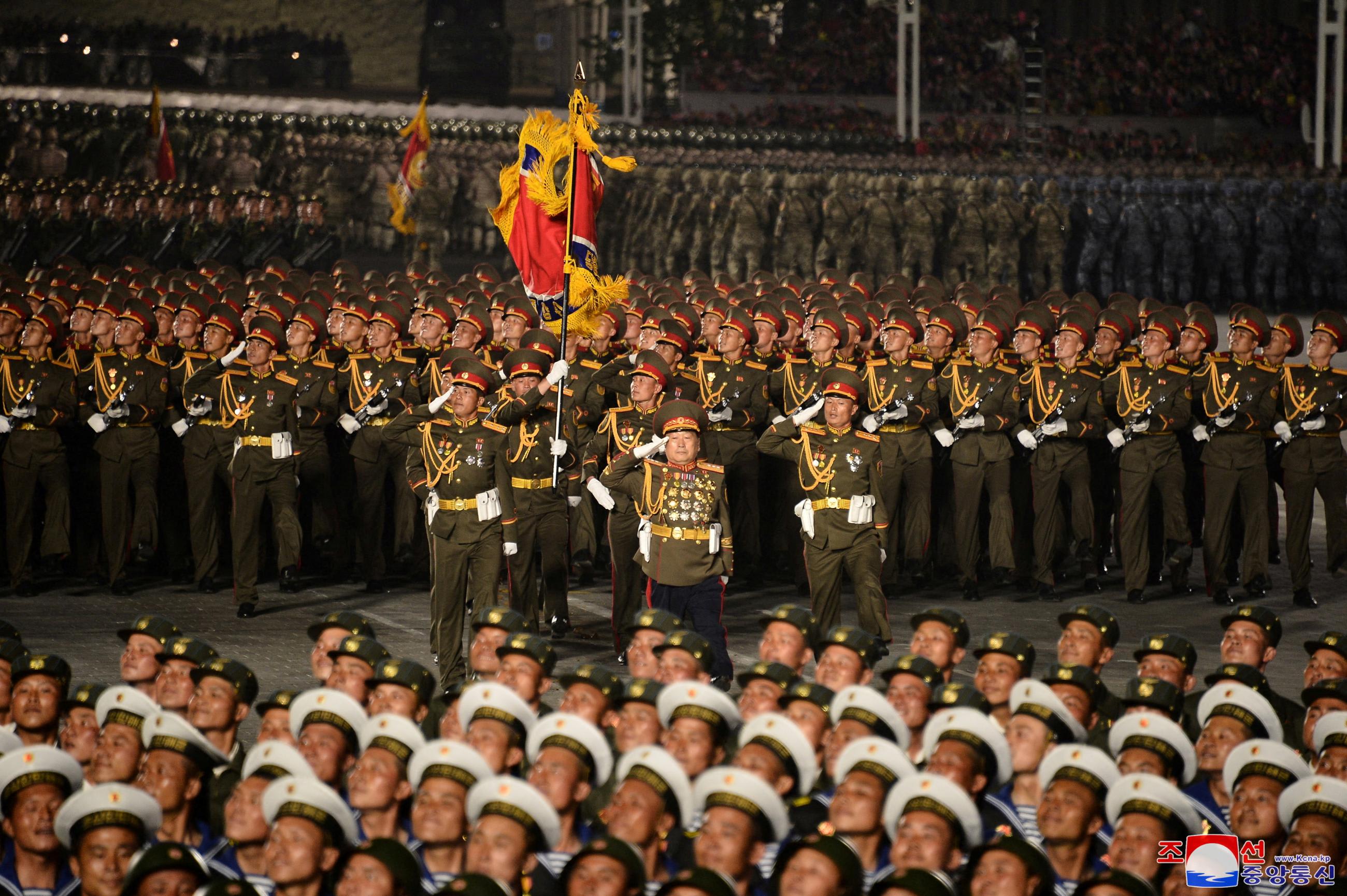 Military personnel take part in a nighttime parade to mark the 90th anniversary of the founding of the Korean People's Revolutionary Army in Pyongyang, North Korea, in this undated photo released by North Korea's Korean Central News Agency (KCNA) on April 26, 2022.