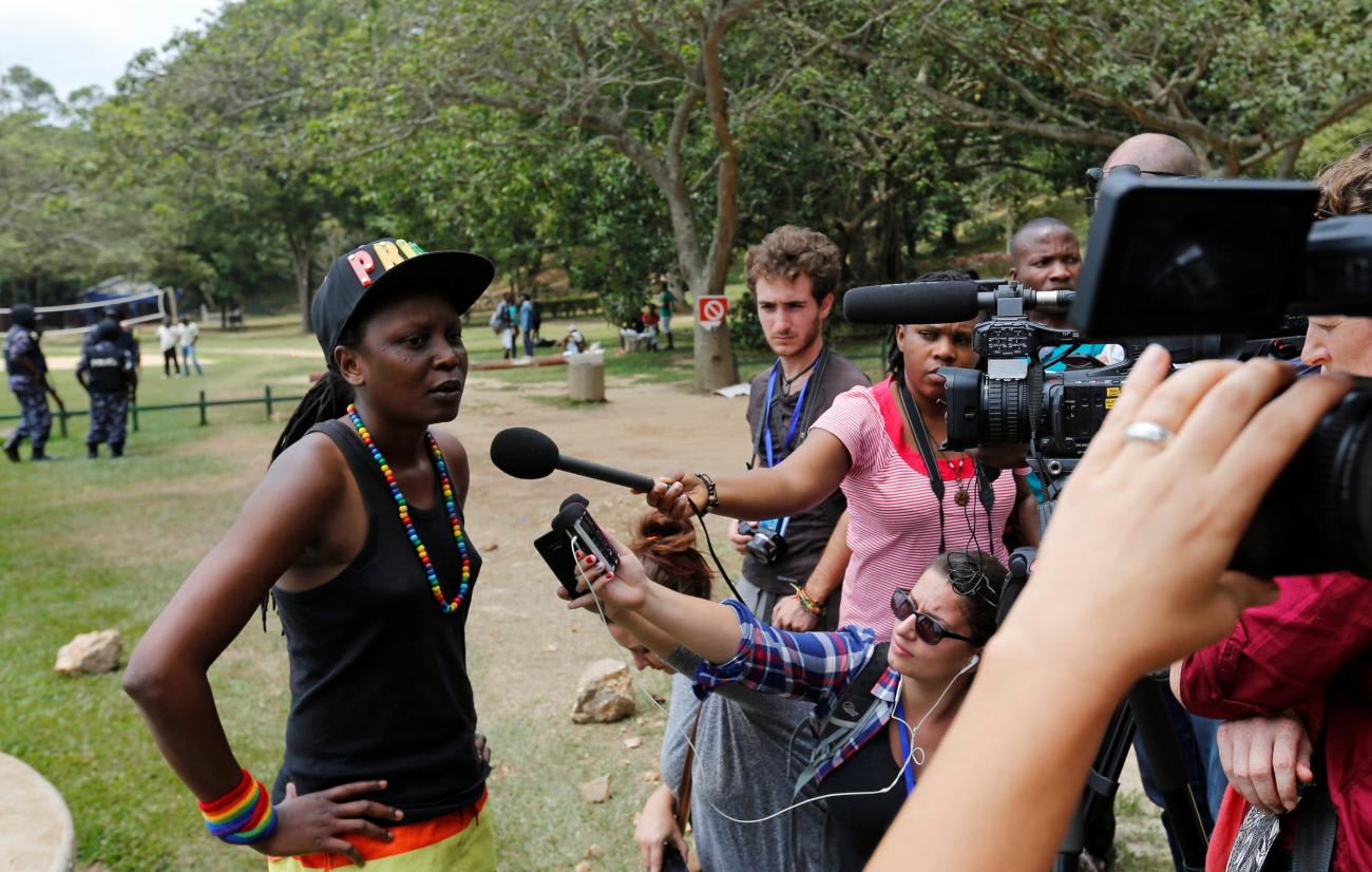 A member of Uganda's LGBTQ+ community speaks to the media after Ugandan police stopped their pride parade.