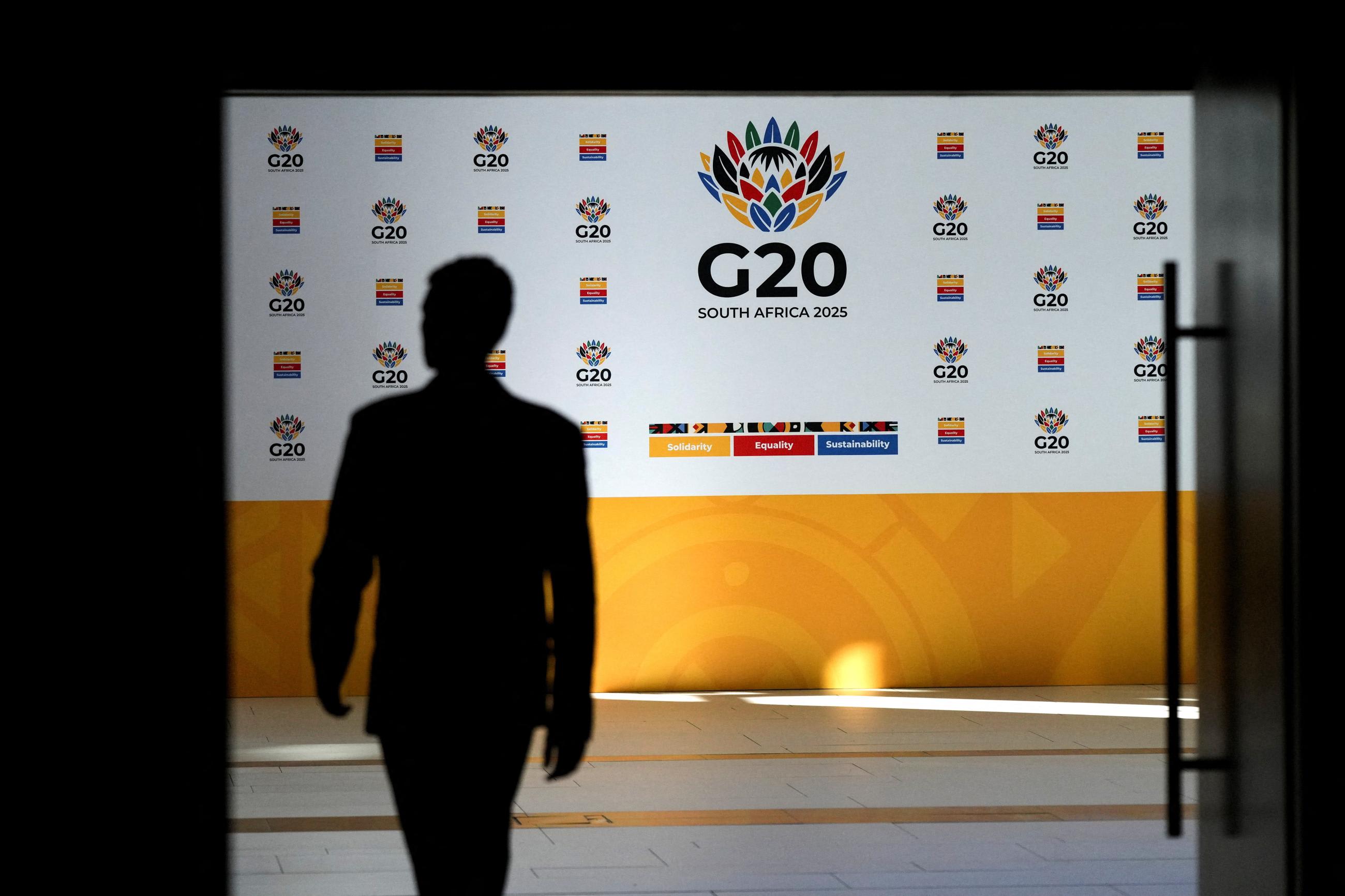 A man walks at the Cape Town International Convention Center during the G20 Finance Ministers meeting, in Cape Town, South Africa, on February 25, 2025.
