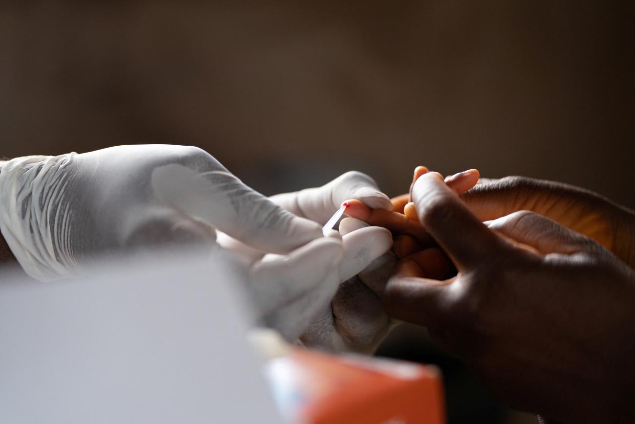 Blood is collected from a child to test for Malaria, at Chileka Health Center, in Lilongwe, Malawi 