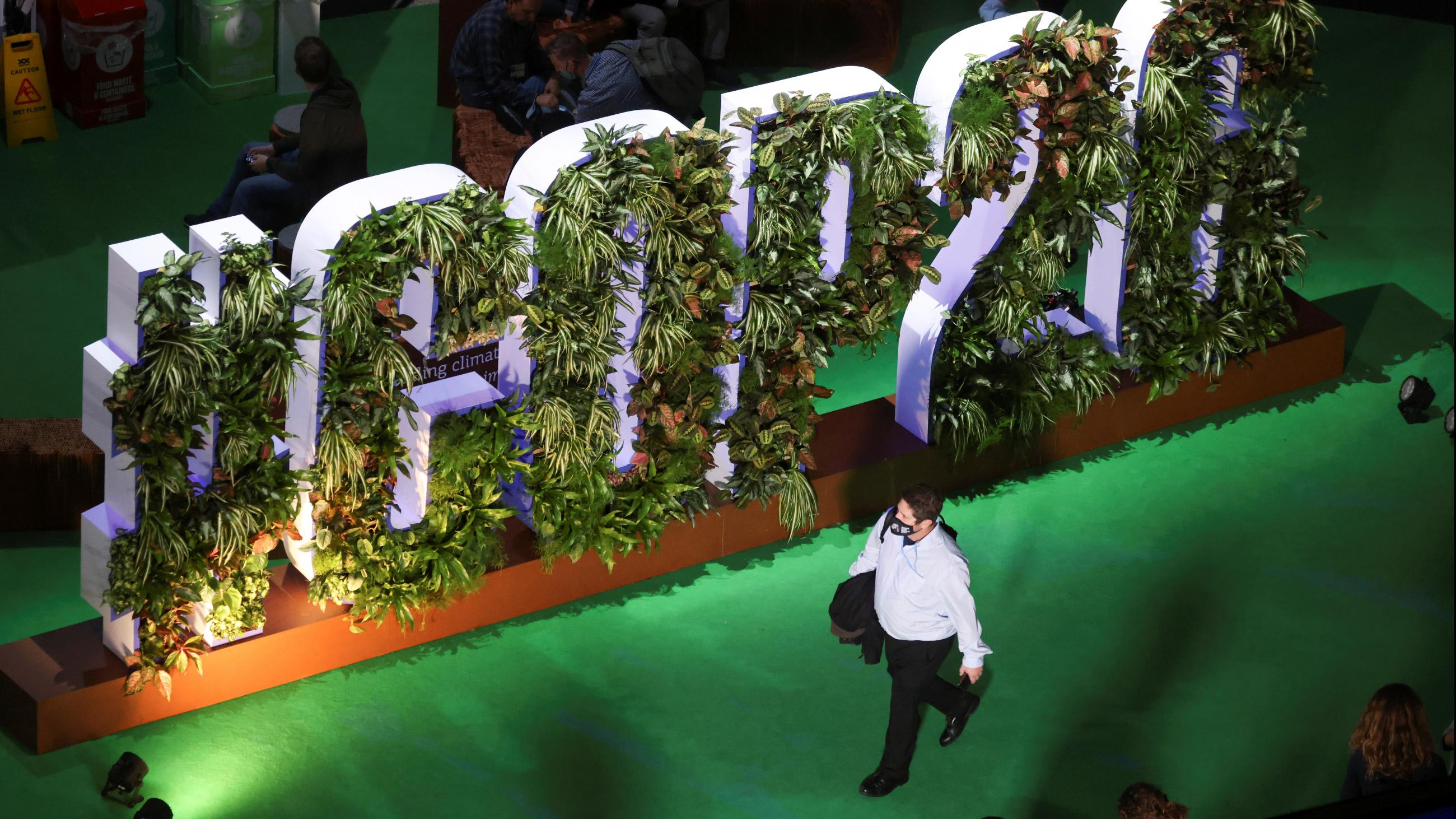 A delegate wanders through the conference venue in Glasgow.