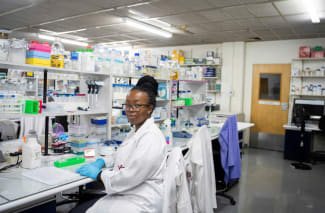 A medical laboratory technician at the Wits Antiviral Gene Therapy Research Unit poses for a portrait, in the research lab at the Wits University Faculty of Health Sciences, in Johannesburg, South Africa, on February 14, 2025.