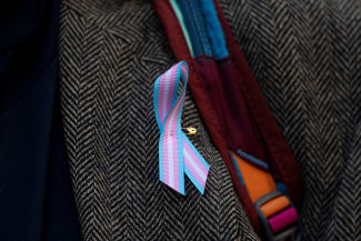 A supporter wears a pro-trans ribbon, in Seattle, Washington, on February 28, 2025.