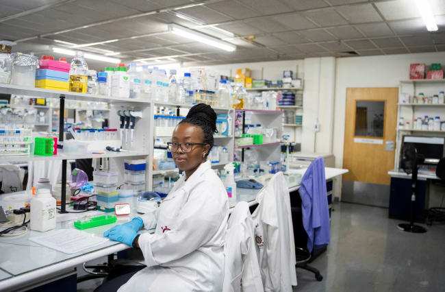 A medical laboratory technician at the Wits Antiviral Gene Therapy Research Unit poses for a portrait, in the research lab at the Wits University Faculty of Health Sciences, in Johannesburg, South Africa, on February 14, 2025.