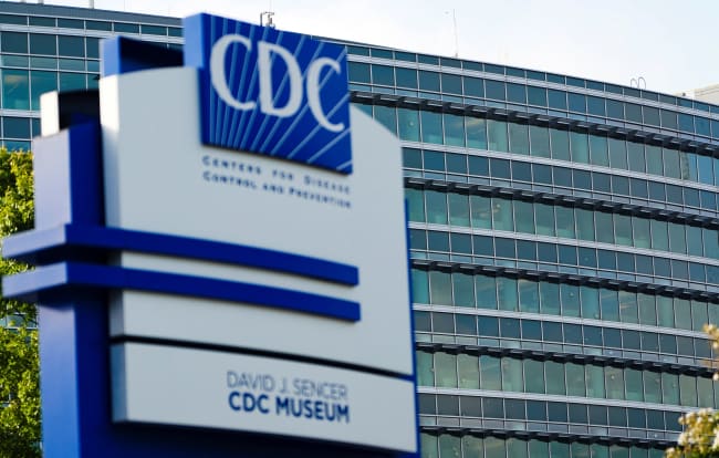 The glass of the Center of Disease Control and Prevention (CDC) building is pockmarked by bullet holes, following a deadly shooting incident, in Atlanta, Georgia, on August 9, 2025.