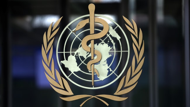 A logo is pictured on the headquarters of the World Health Organization (WHO) ahead of a meeting of the Emergency Committee on the novel coronavirus in Geneva, Switzerland on January 30, 2020. The photo shows a closeup of the logo on a dark background. REUTERS/Denis Balibouse