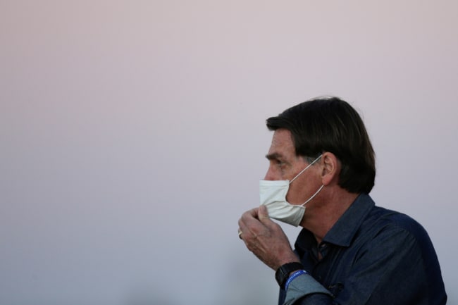 President Jair Bolsonaro is seen during a ceremony to lower the Brazilian National flag down for the night, at the Alvorada Palace, amid the coronavirus disease (COVID-19) outbreak, in Brasilia, Brazil, July 15, 2020.
