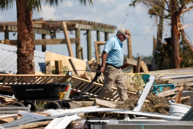 A resident of Keaton Beach works to recover their belongings from their home after Hurricane Helene passed through the Florida panhandle.