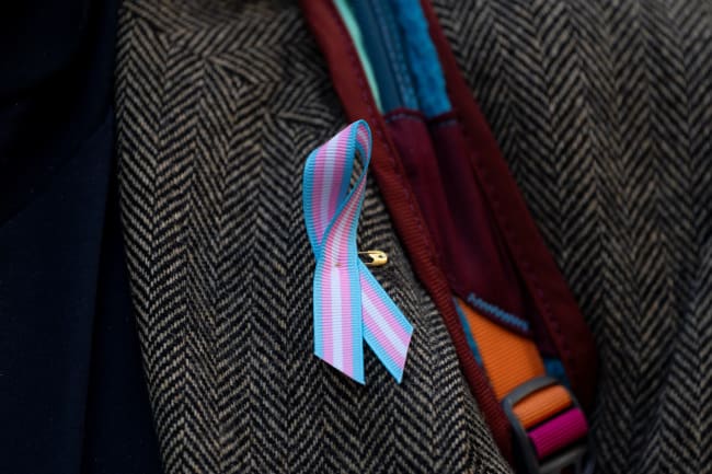 A supporter wears a pro-trans ribbon, in Seattle, Washington, on February 28, 2025.