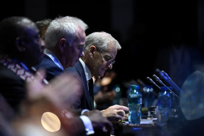 Norway's Prime Minister Jonas Gahr Store listens during the Global Fund event, in Sandton, Johannesburg, South Africa, on November 21, 2025