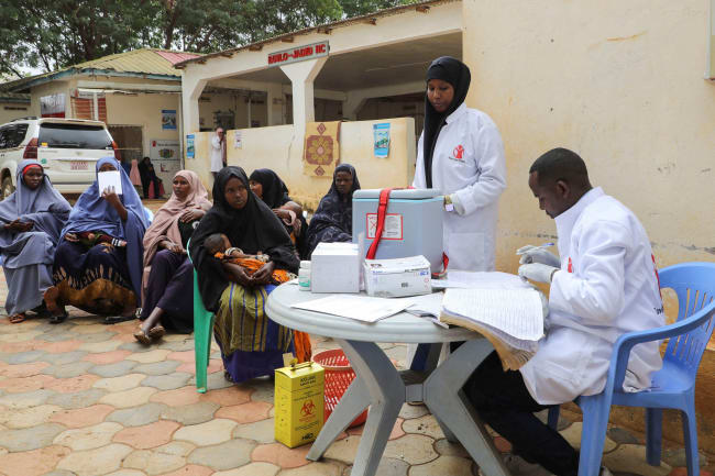 A nurse from Save the Children prepares vaccinations for internally displaced Somali children, in Baidoa, Somalia, on June 25, 2025.