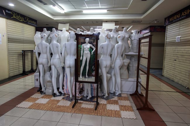 Virtual shoppers: mannequins are pictured in the middle of a corridor at a closed shopping mall amid the spread of coronavirus disease (COVID-19) in Jakarta, Indonesia March 31, 2020. This is a powerful photo of an intriguing subject matter—a bunch of mannequins stacked up in the middle of a corridor. REUTERS/Fransiska Nangoy