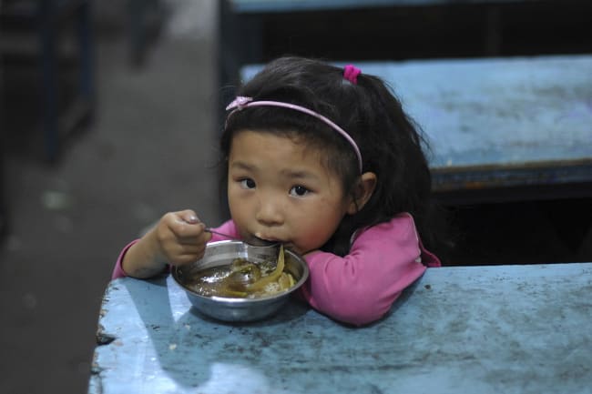 A child eats her lunch in a classroom at a primary school in Hefei, Anhui Province, China on June 1, 2011.