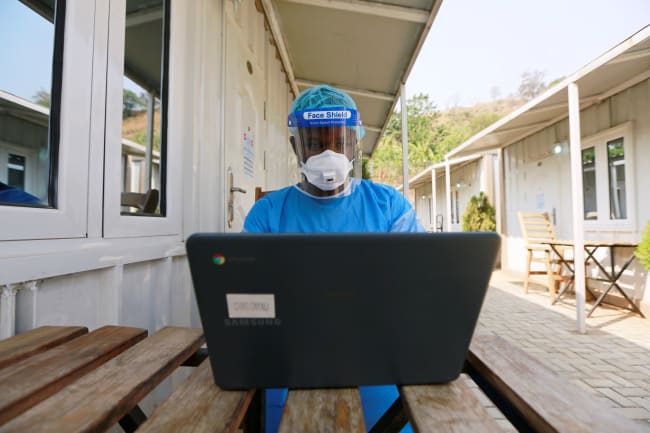 A health professional works on a computer at a drive-through sample collection center for coronavirus disease (COVID-19) in Abuja, Nigeria January 14, 2021.