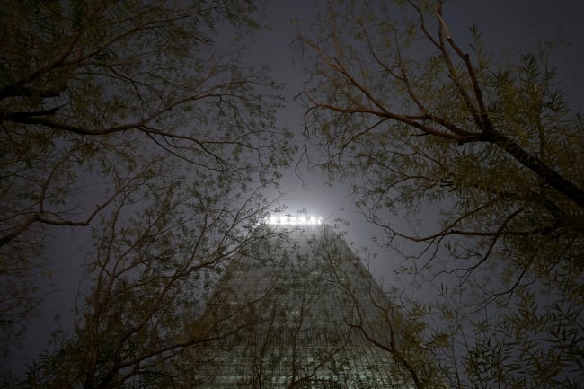 A building is pictured through trees amid heave smog on a polluted day, in Beijing, China, on December 2, 2018.