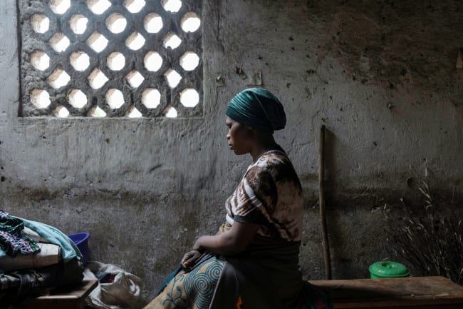 Florence Mushimye poses for a portrait in a classroom where they are taking refuge after being asked to leave Kalenga village by the M23 rebels, in Sake, eastern Democratic Republic of Congo, on March 13, 2025.