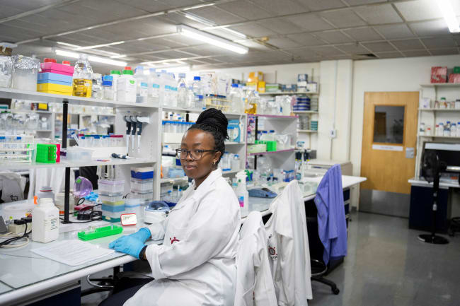 A medical laboratory technician at the Wits Antiviral Gene Therapy Research Unit poses for a portrait, in the research lab at the Wits University Faculty of Health Sciences, in Johannesburg, South Africa, on February 14, 2025.