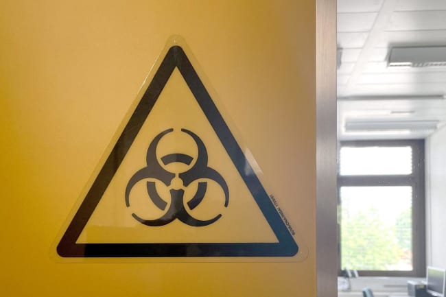 A biohazard sign is displayed in the biocontainment facility of the Spiez Laboratory, in Spiez, Switzerland, on June 8, 2022.