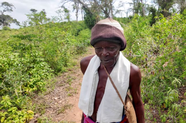 David Garera, a Mijikenda community elder, is seen walking in the coastal region of Kilifi, Kenya, on February 13, 2025.