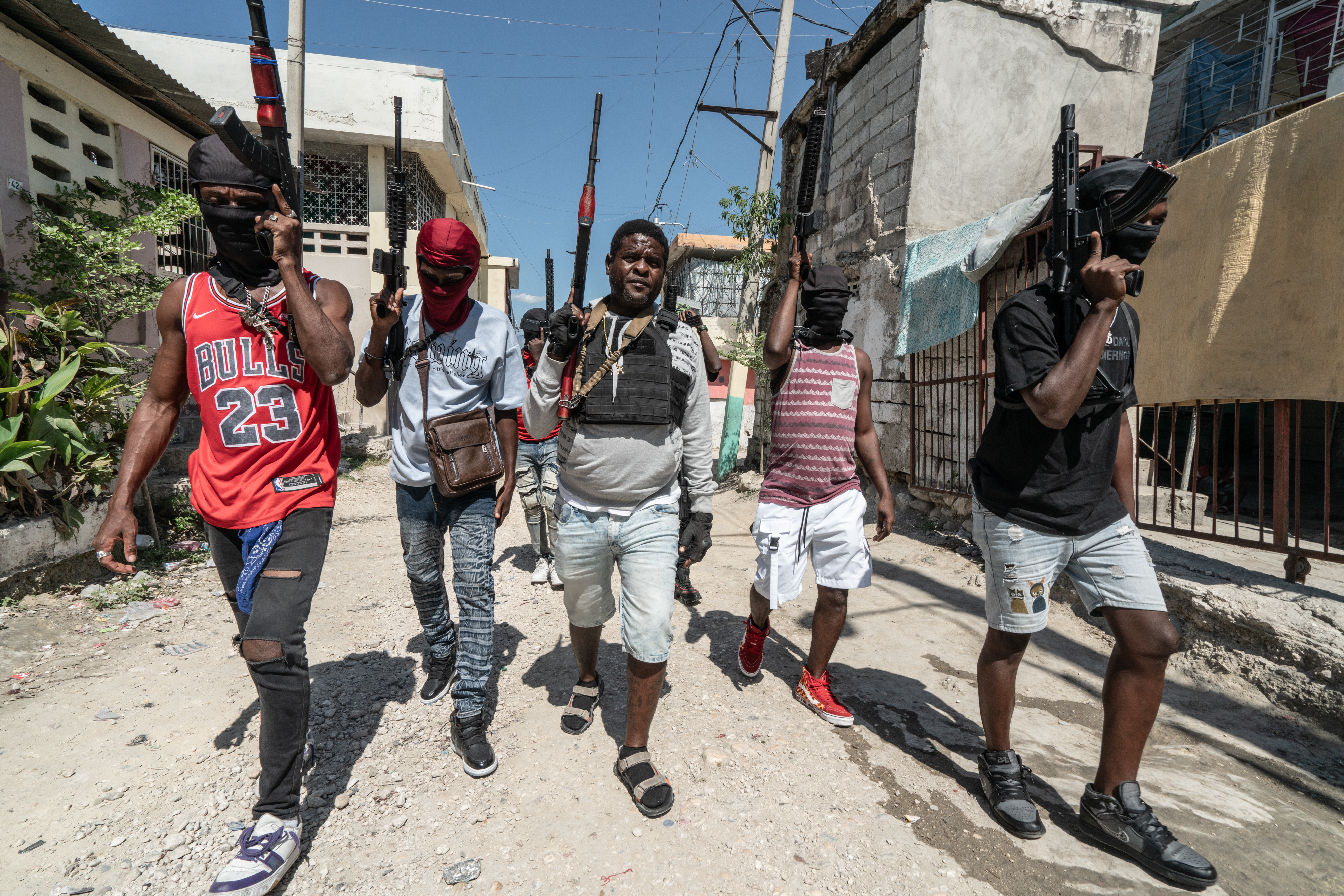 A photo of gang Leader Jimmy ‘Barbecue’ Cherizier patrolling the streets with gang members in Port-au-Prince, Haiti