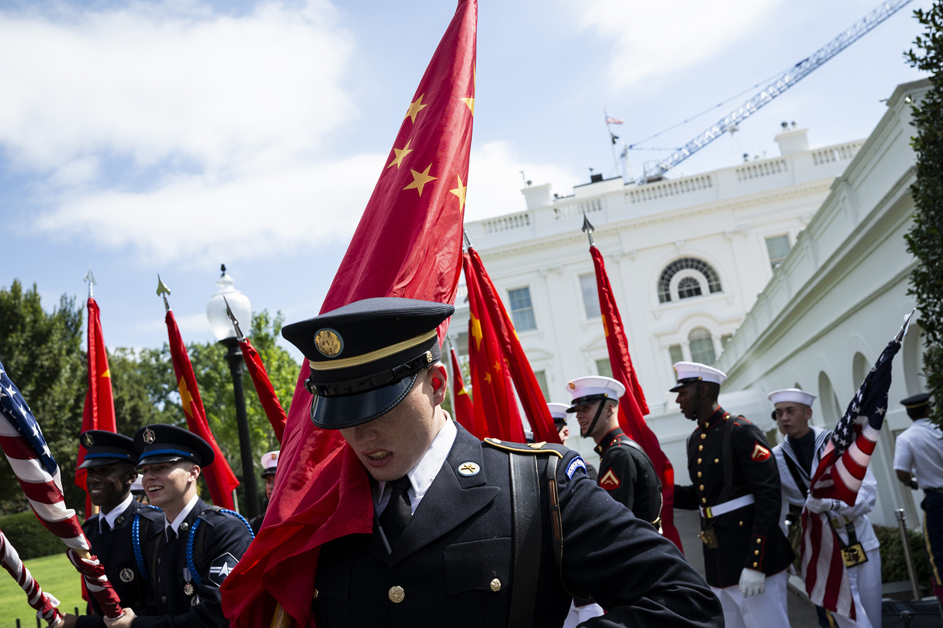 Members of a U.S. Military Honor Guard gather near the White House during rehearsals before a visit by President of China Xi Jinping next week, on September 19, 2026 in Washington, DC.
