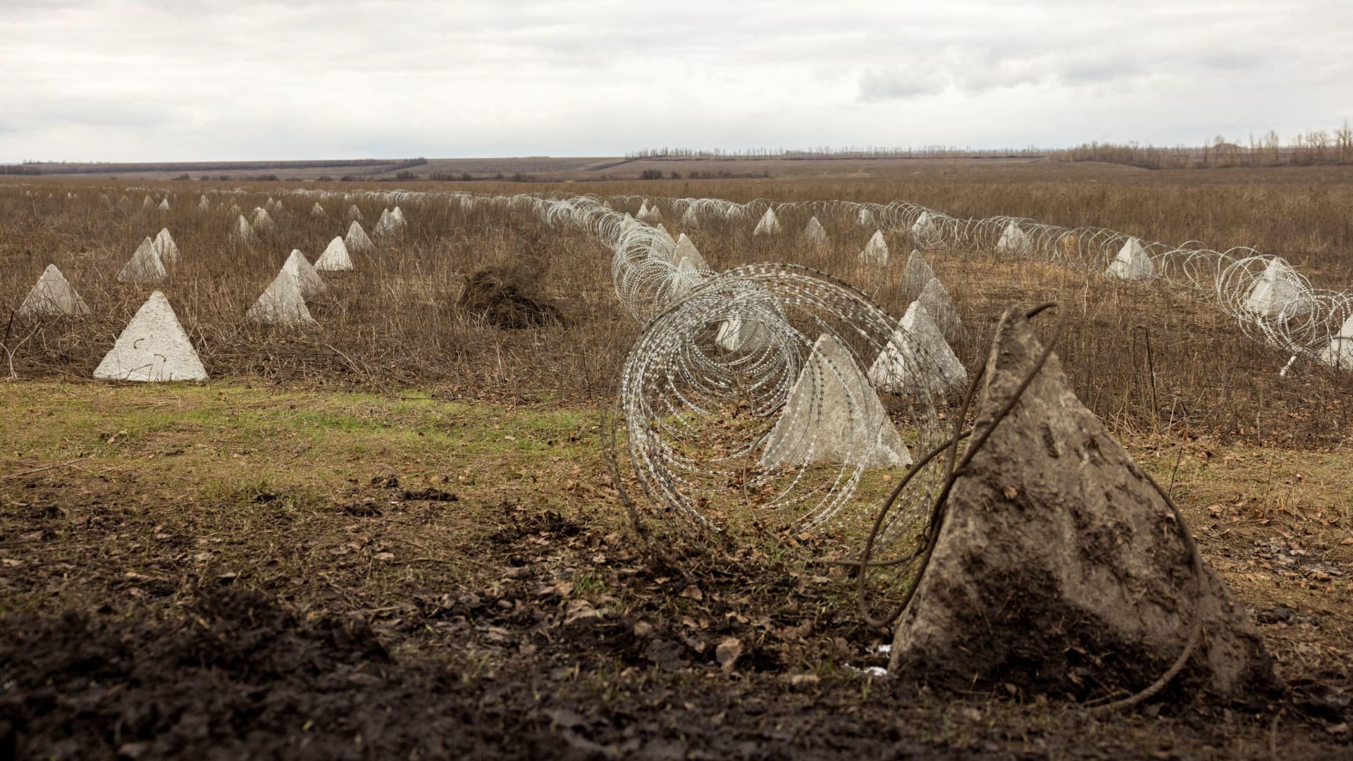 <p>Fortifications built by the Ukrainian army stretch across a field near the front line outside Kupiansk, Ukraine.</p>
