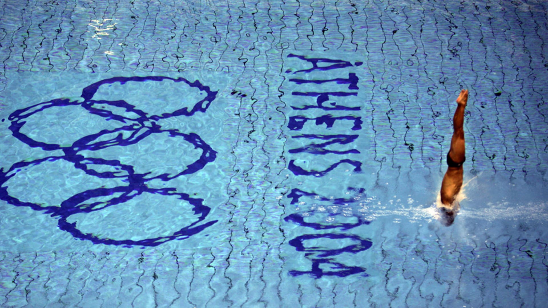 An athlete dives during a training session in the Olympic aquatic center in Athens ahead of the start of the 2004 Olympic Games. 

