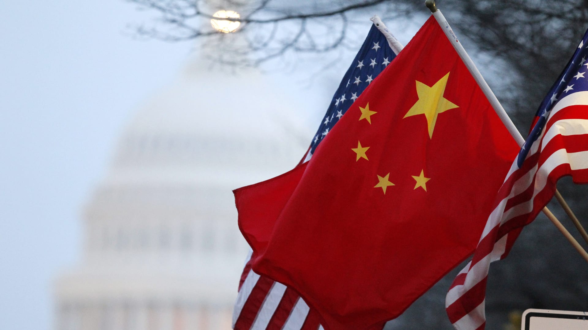 The People's Republic of China flag and the U.S. Stars and Stripes fly along Pennsylvania Avenue near the U.S. Capitol in Washington