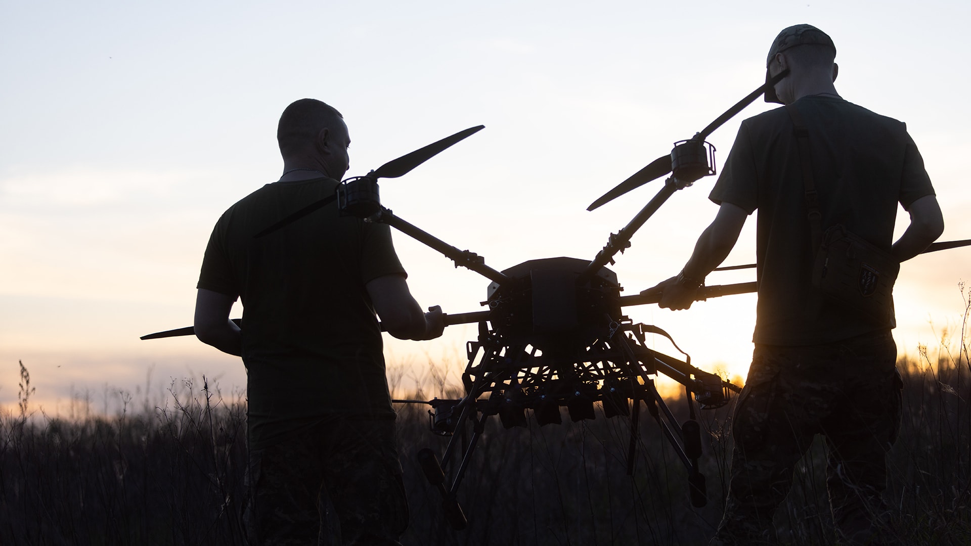 <p>Ukrainian soldiers of the 127th Heavy Mechanized Brigade carry a Heavy Shot UAV across a field on May 8, 2026, in Kharkiv Oblast, Ukraine. </p>