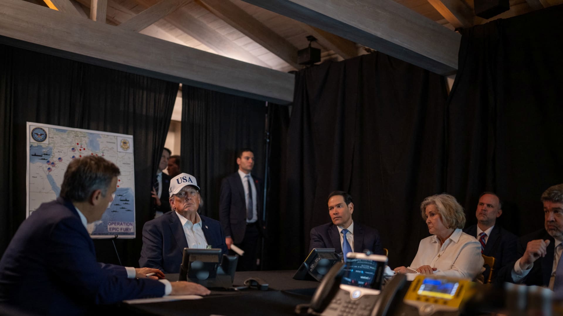 U.S. President Donald Trump speaks with CIA Director John Ratcliffe, White House Chief of Staff Susie Wiles, and Secretary of State Marco Rubio at the Mar-a-Lago resort in Palm Beach, Florida, on February 28, 2026.