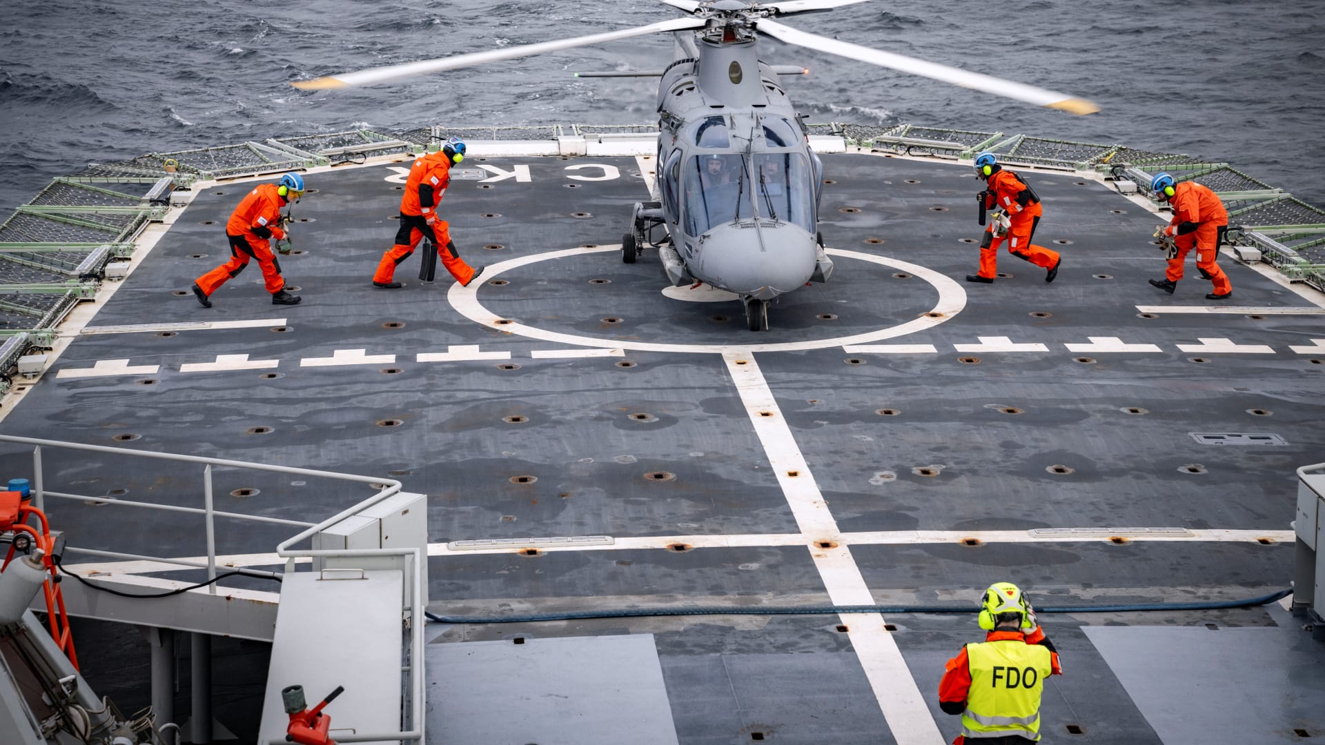 A helicopter lands on the flight deck of the patrol ship HSwMS Carlskrona after it set sail to join NATO’s Operation Baltic Sentry on February 4, 2025.