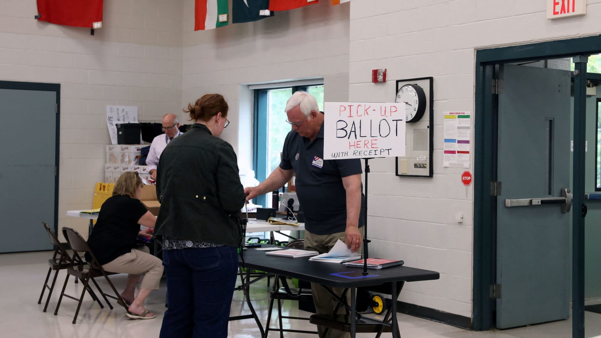 A voter collects her ballot at a polling station during the New Hampshire State Primary Election in Nashua, New Hampshire, U.S., September 8, 2026.