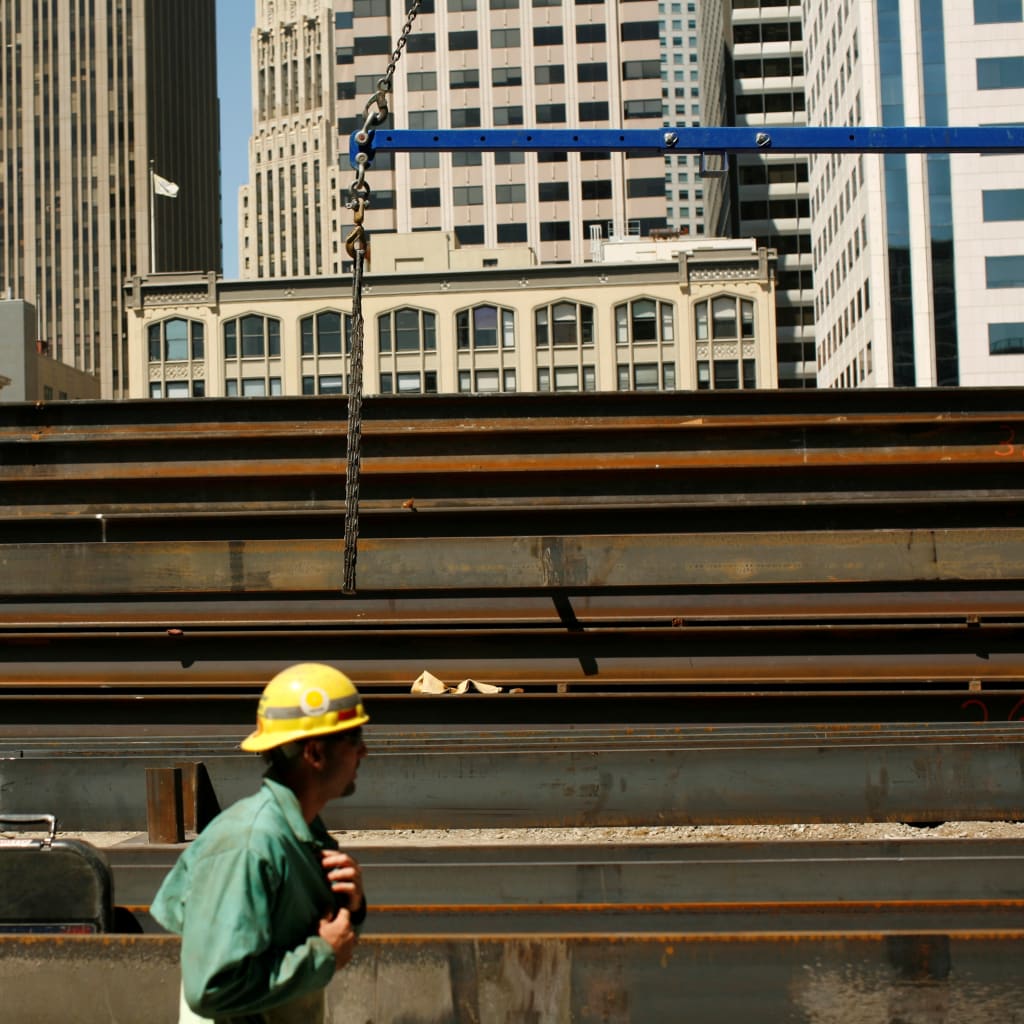 <p>Workers guide steel beams into place at a construction site in San Francisco, California September 1, 2011.</p>
