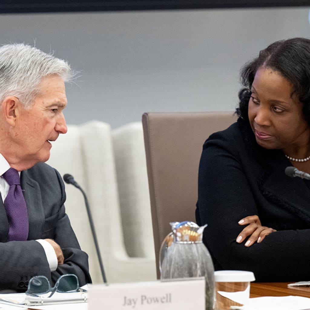 <p>Federal Reserve Chair Jerome Powell speaks with Fed Governor Lisa Cook during a board meeting, June 25, 2025.</p>
