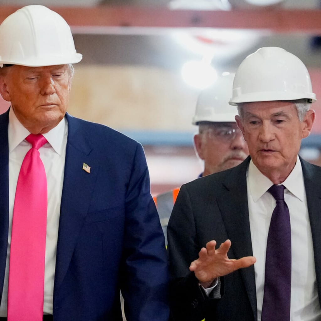 <p>Donald Trump and Fed Chair Jerome Powell walk through the Federal Reserve building on July 24 as it undergoes renovations.</p>
