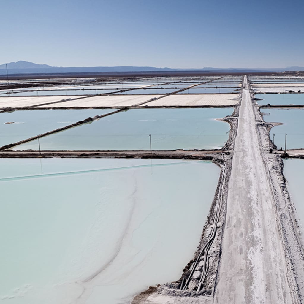 <p>An aerial view of lithium mining pits in Atacama Salt Flat, Chile.</p>

