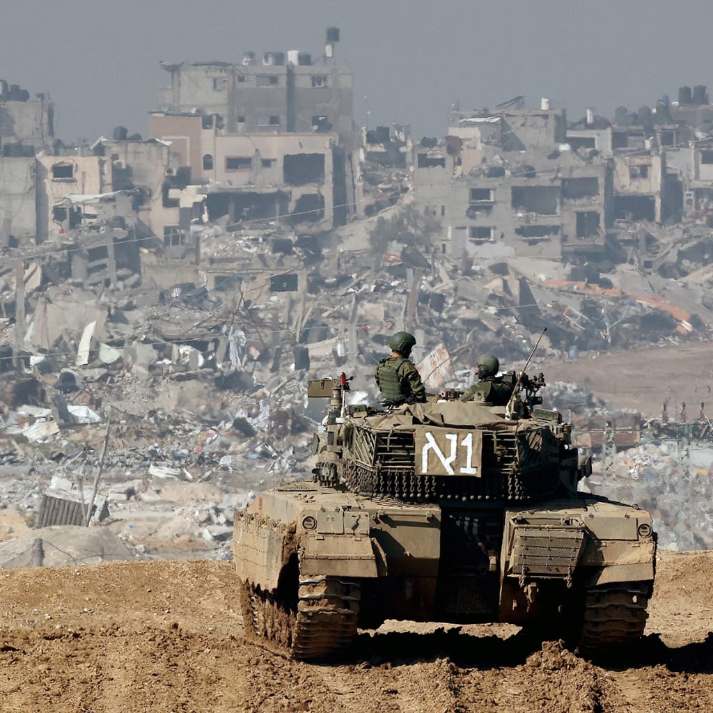 <p>An Israeli tank drives past damaged buildings near the Gaza Strip border in southern Israel on January 19, 2024.</p>
