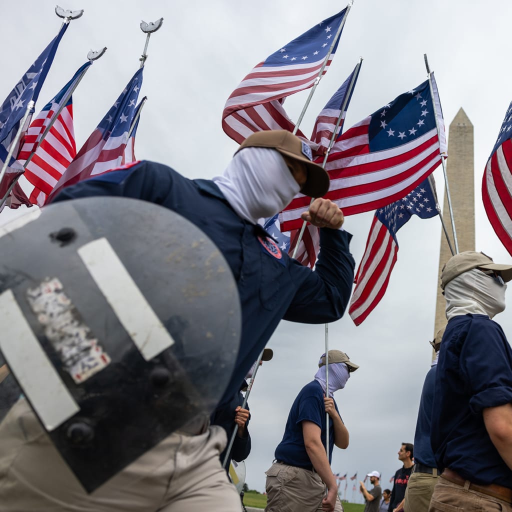 <p>Members of the far-right group Patriot Front march through Washington, DC, on May 13, 2023.</p>
