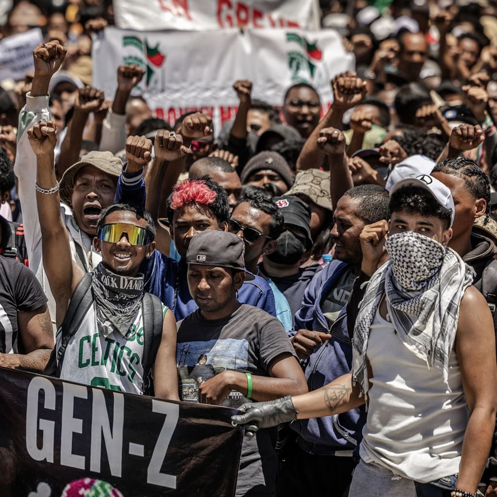 <p>Demonstrators hold banners as they gather outside City Hall in Antananarivo, Madagascar, October 13, 2025.</p>
