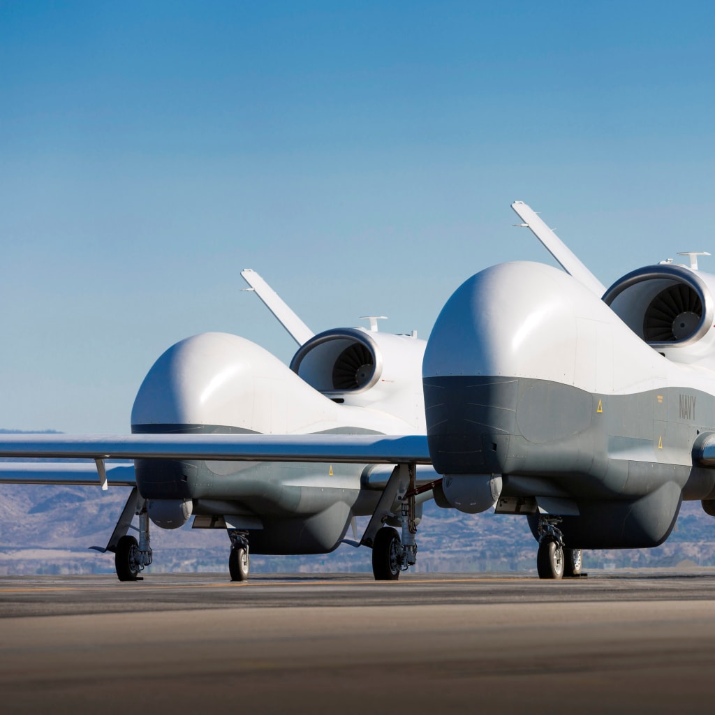<p>Two Northrop Grumman MQ-4C Triton unmanned aerial vehicles are seen on the tarmac at a Northrop Grumman test facility in Palmdale, California on May 22, 2013</p>
