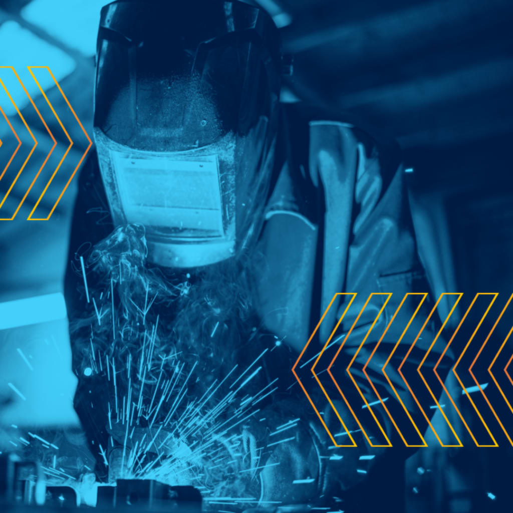 <p>Steel worker welds metal in a factory.</p>
