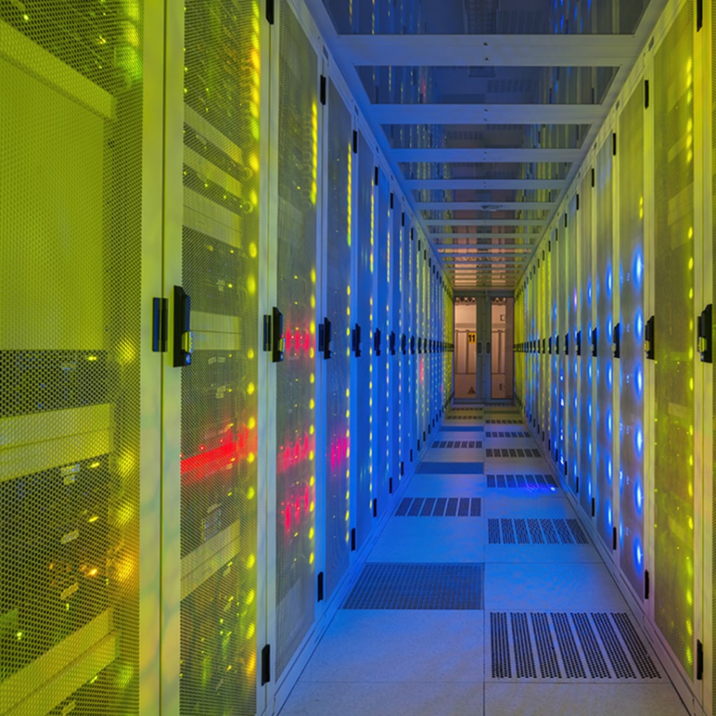 <p>Multi colored server room of data center.</p>
